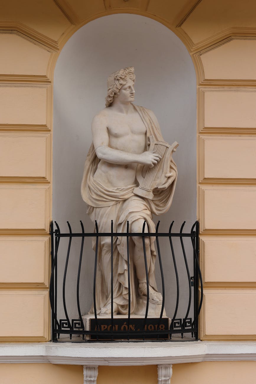 statue of apollo with cithara